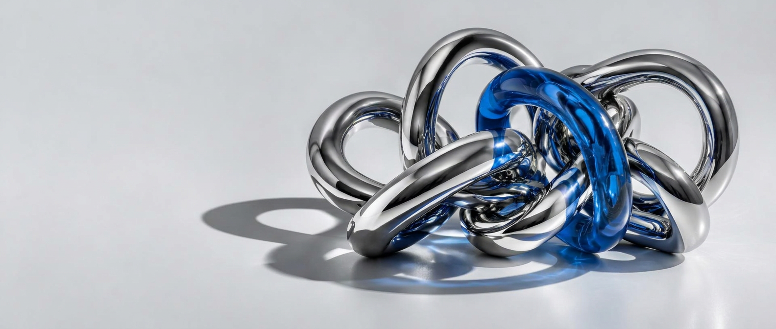 Interconnected chrome and blue sculpture representing connected digital growth